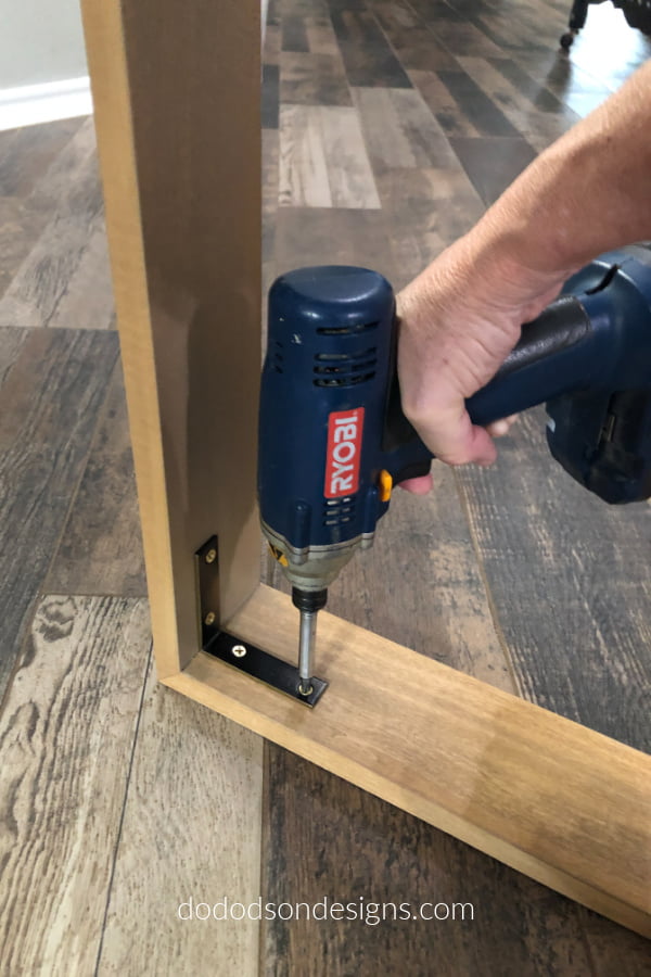 L brackets were used inside the frame to create a gap for the canvas to rest on. DIY Floating Frame Tutorial