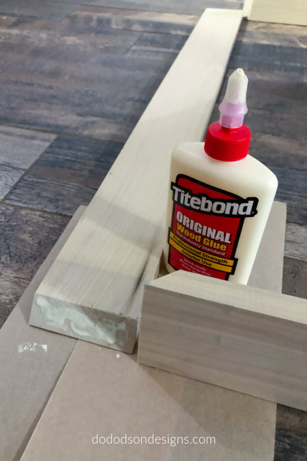 I used wood glue to connect the two ends on the DIY floating frame. This makes for a tight bond.