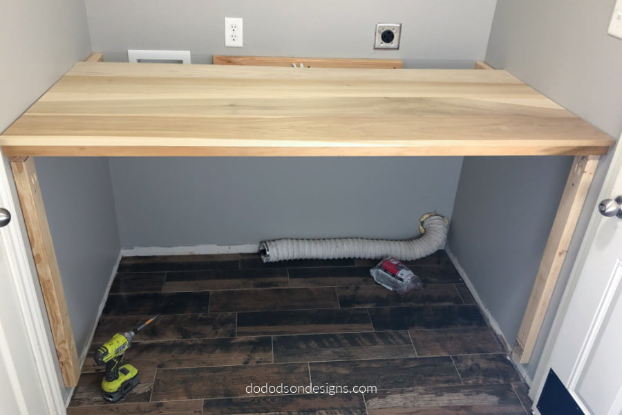The folding station was taking shape but we had an issue with the utilities being too high. We decided to build a removable shelf that would allow us to cover but still have access when needed.