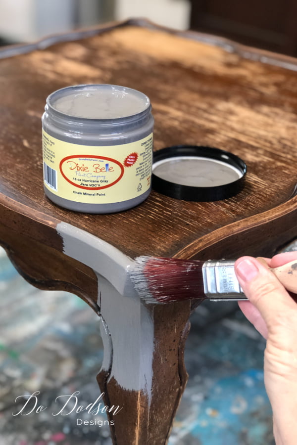 I like to paint the table before adding the tiled table top. This will prevent getting the paint in the grout lines around the edges.
