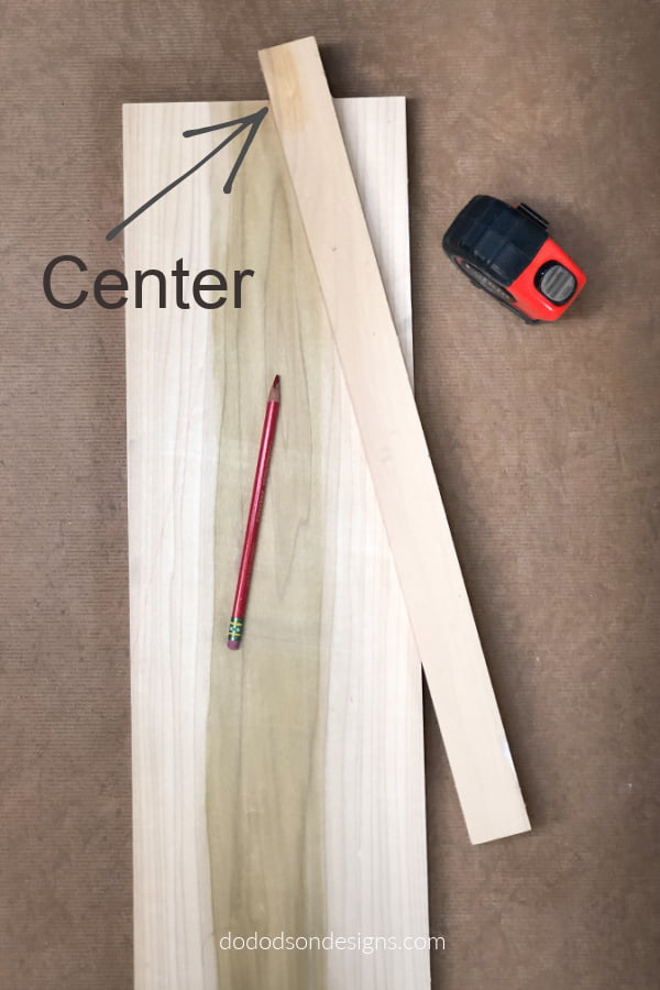 Find your center and draw a line to the point where you want the roof line to stop and repeat on the other side.