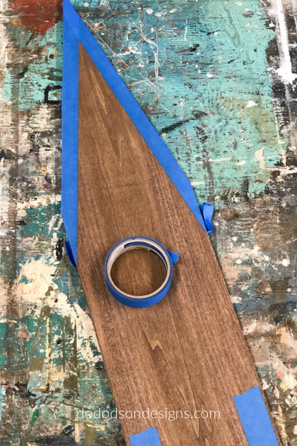 Consider using painter's tape to create the roofline and the door on the DIY wood church. That's what I did here.