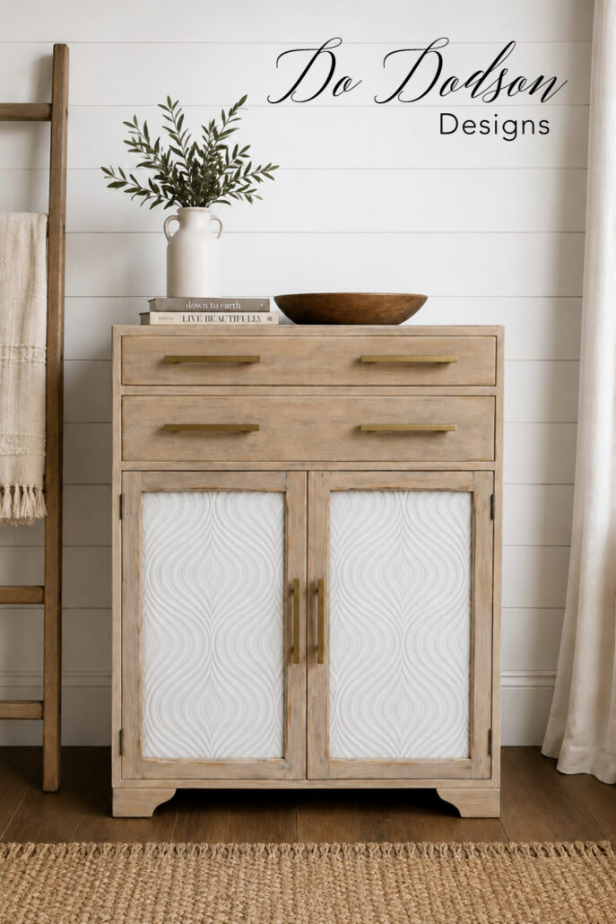 DIY furniture update on white textured wallpaper on a refinished dresser cabinet.