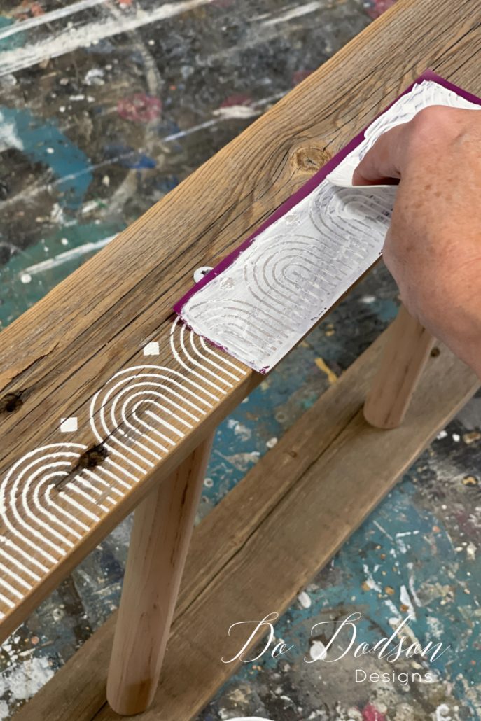 Before the application, be sure the area that you are stenciling on is clean and free of dust for the best results. Rub over the stencil gently once in place to make sure it adheres properly. Next, use the plastic spatula applicator in the package to apply a minimal amount of chalk mineral paint over the stencil. You will need very little paint for this.