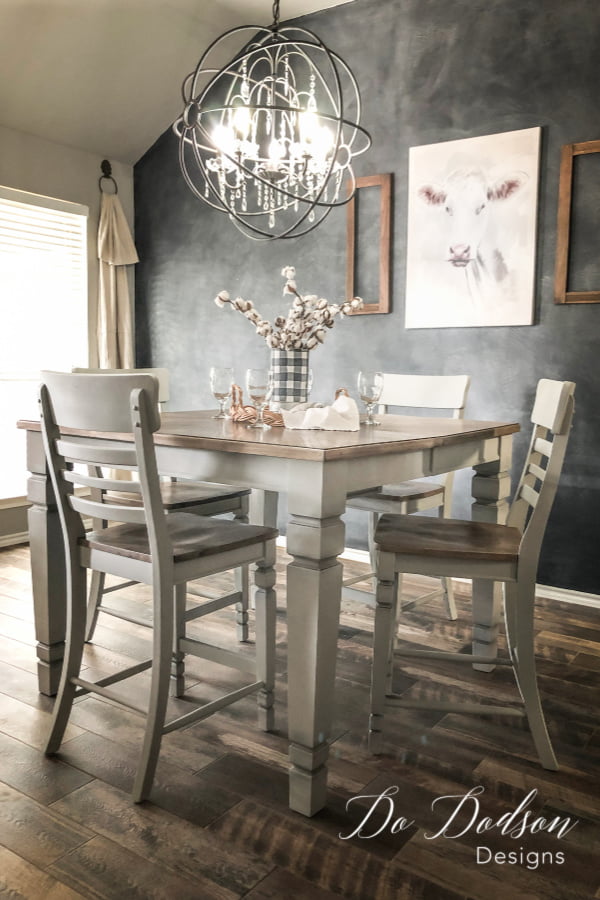 I refurbished this farmhouse pub style table and chairs with grey chalk paint and refinished the wood on the seats and table top. Isn't it stunning?