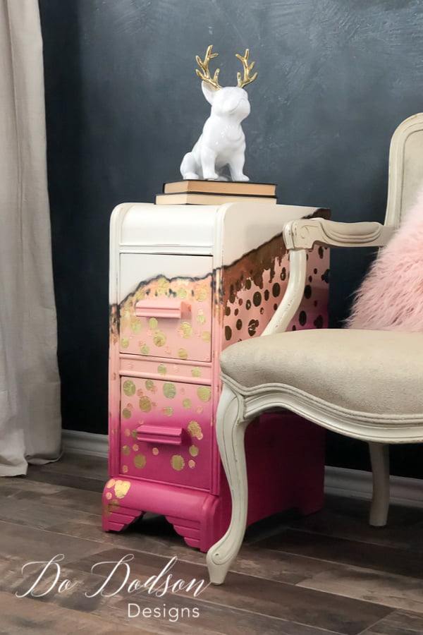 For the little girl inside me that screams to get out every once in a while... I created this bold whimsical look on this repurposed vanity turned side table using chalk paint colors in Peony, Apricot and Butter Cream. Of course I had to add a touch of gold leaf.