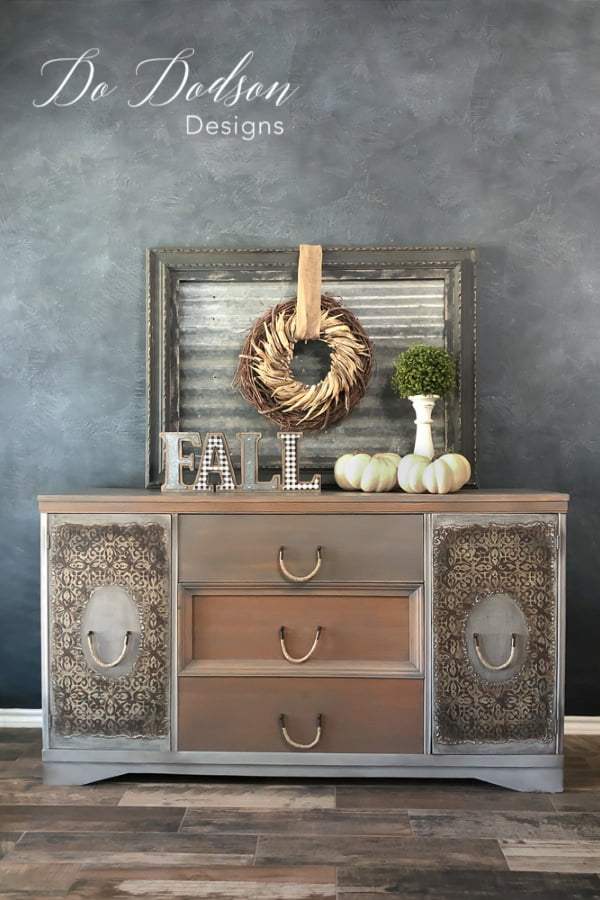 Raised stenciling on the doors of this vintage dresser gives it an embossed metal appearance. It's just chalk paint with a texture additive.