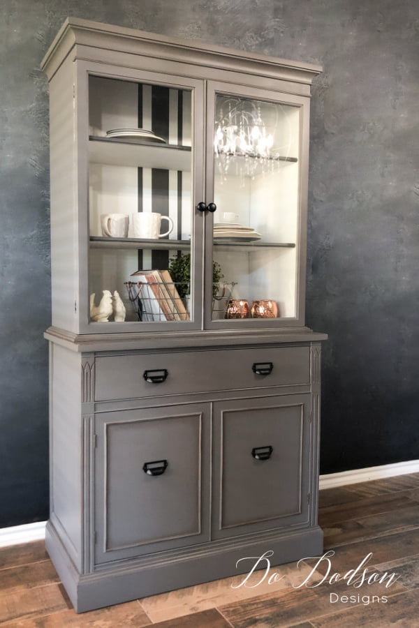 Bring on the gray, baby! This gorgeous gray hutch with french grain stripes was painted with Dixie Belle chalk paint in Hurricane gray.