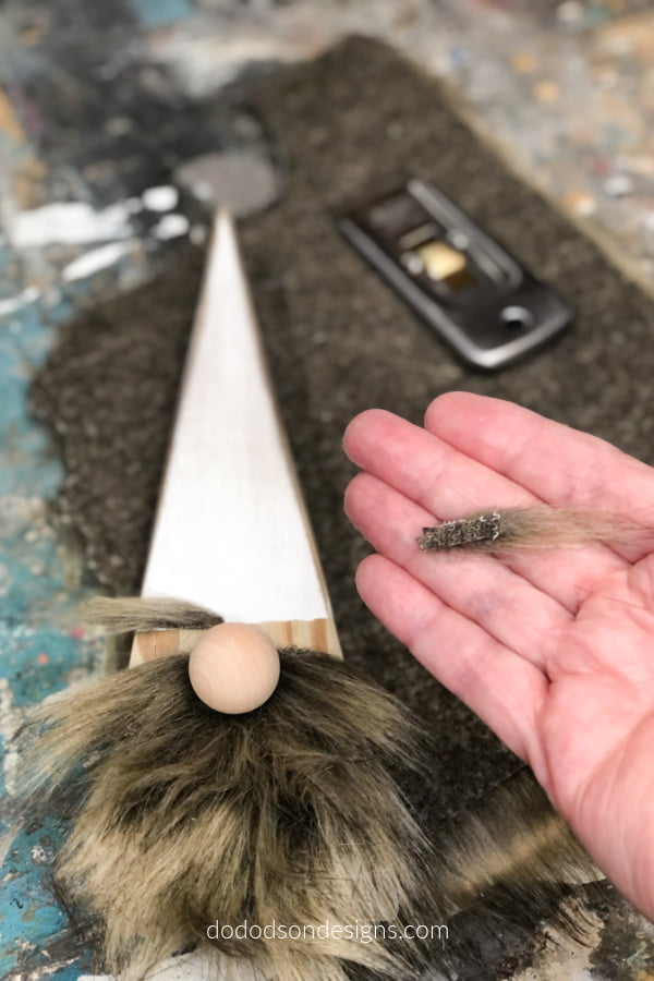 The eyebrows on this DIY wood block gnome were cut from faux fur to match the beard. So Stinking CUTE! I can't wait to sit him on my Christmas mantel.