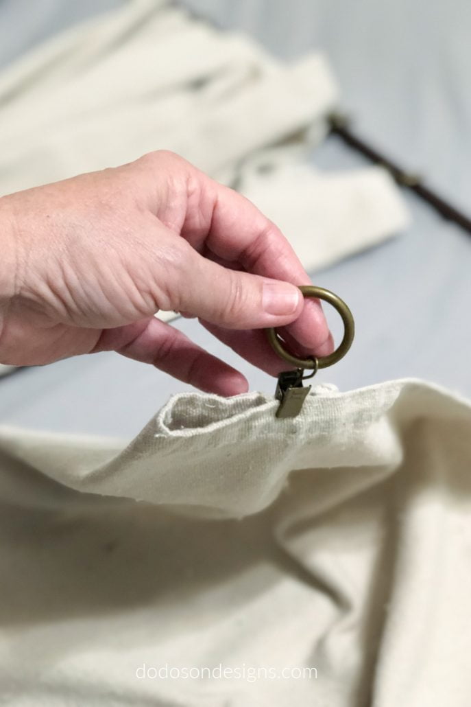 I used curtain ring clips to make pleats in my DIY drop cloth curtains before hanging.