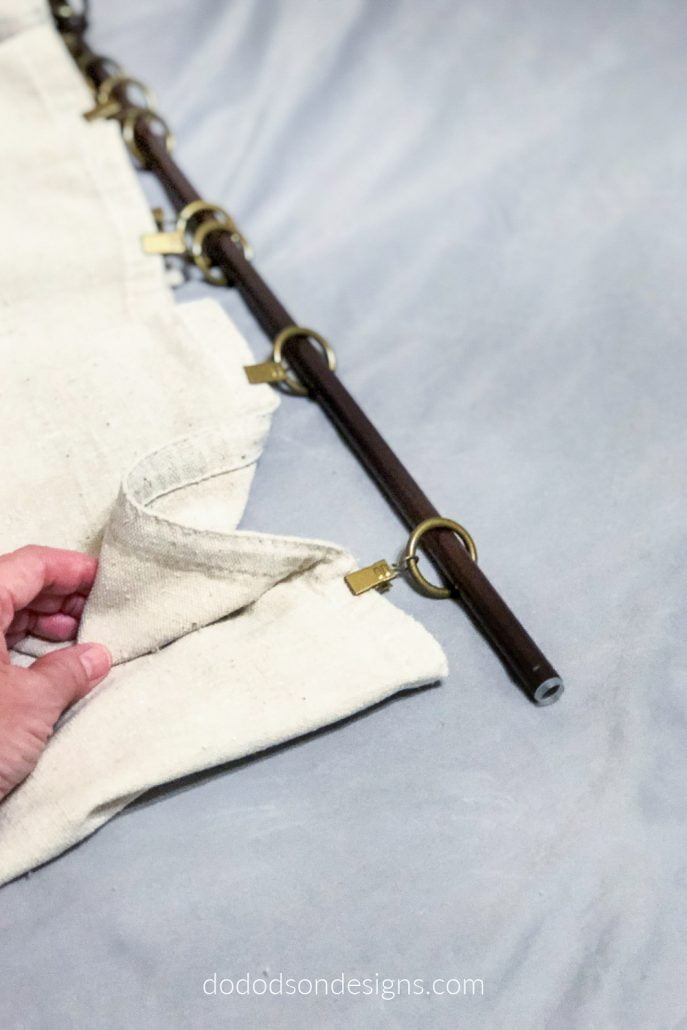 Curtain ring clips are the perfect option for hanging DIY drop cloth curtains.