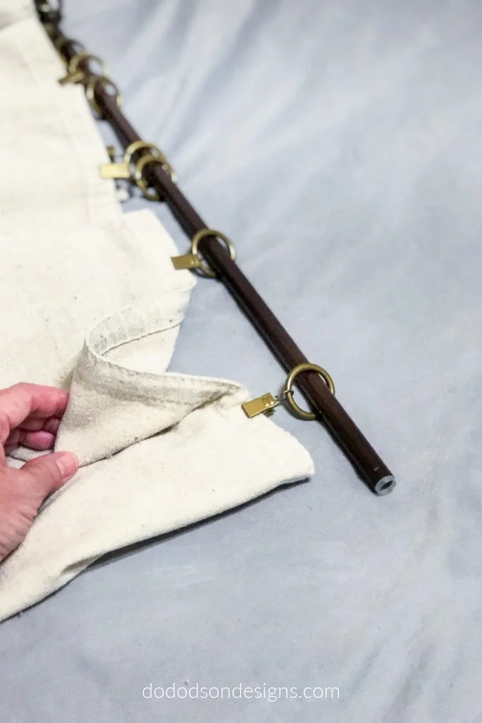 Curtain ring clips are the perfect option for hanging DIY drop cloth curtains.