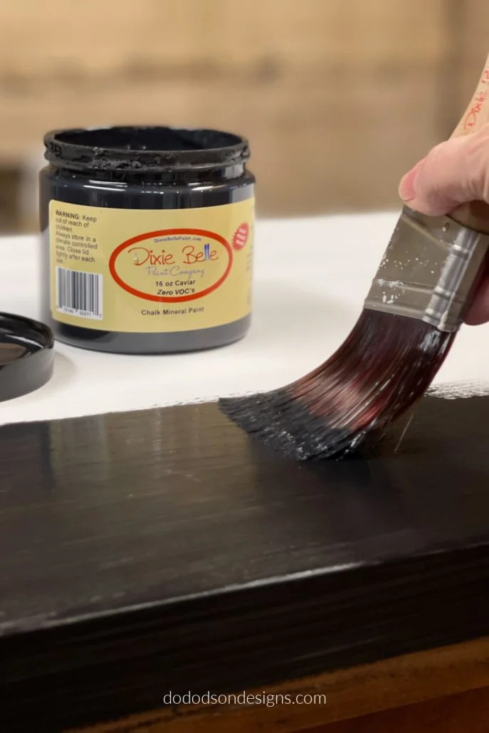 Apply two coats of your favorite chalky based paint and now no one will ever know it's a laminate piece of furniture.