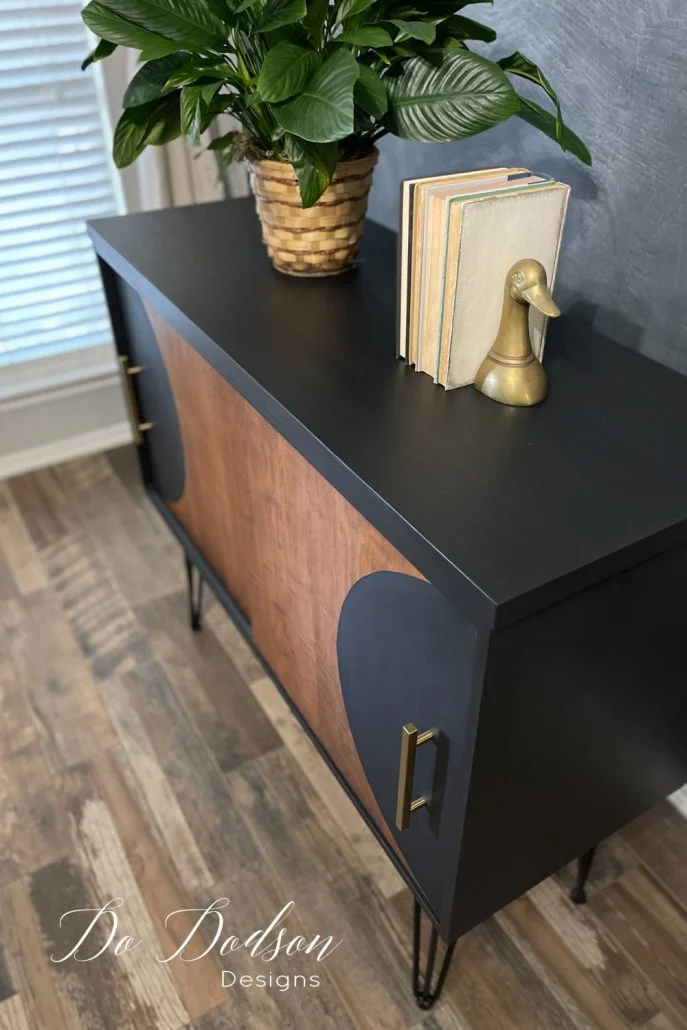 Learn how I painted over this 1970s piece of laminate furniture and gave it an edgy feel. I love the modern vibe!