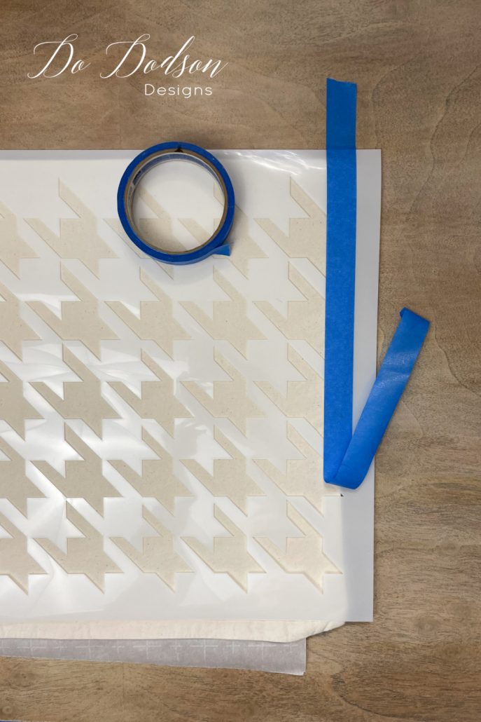 One of the step in how to stencil on fabric is securing the fabric so that it doesn't move in the process.