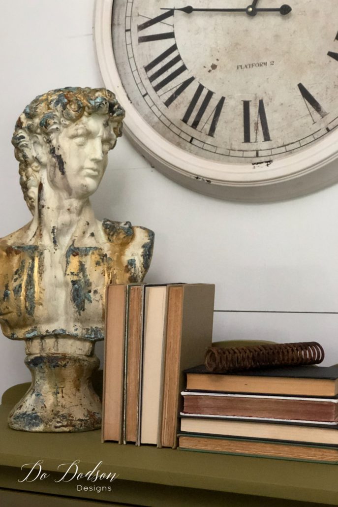 For many people styling their home with decor can be challenging. Try this... Use a tall decor object and then stack books in this fashion against it. This will create a visual triangle that allows the eyes to travel. Can you see the triangle?