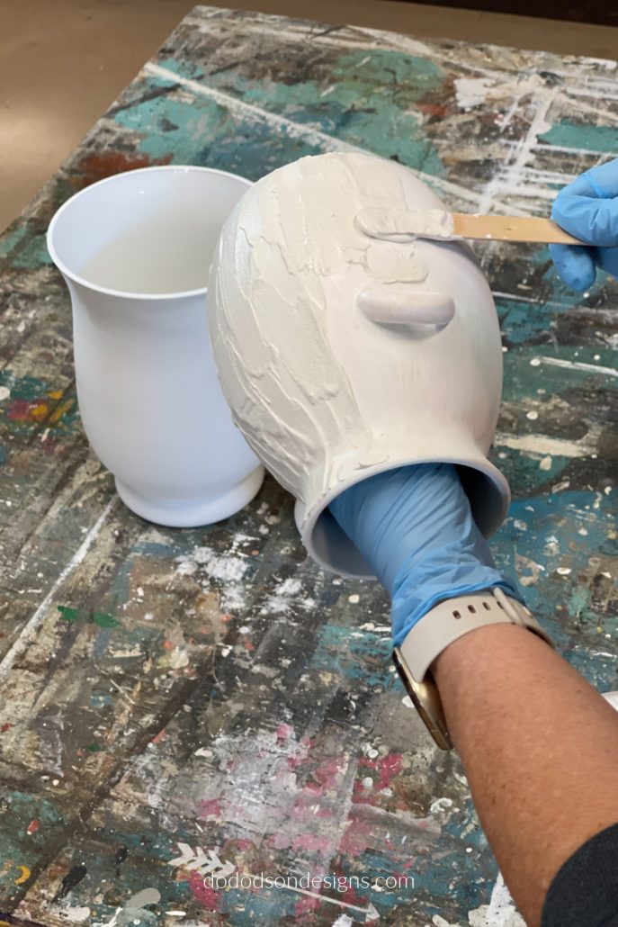 Add the Plaster of Paris mixture to the vases using a craft stick. This will create that beautiful Pottery Barn Inspired look. 