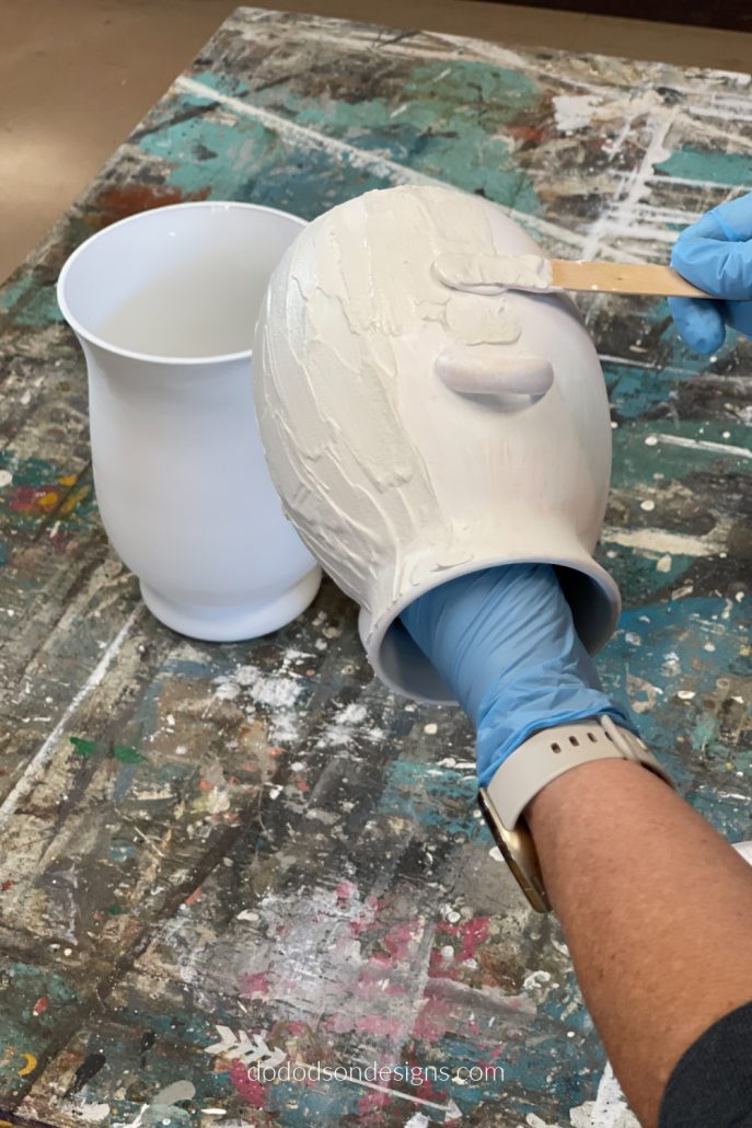 Add the Plaster of Paris mixture to the vases using a craft stick. This will create that beautiful Pottery Barn Inspired look.