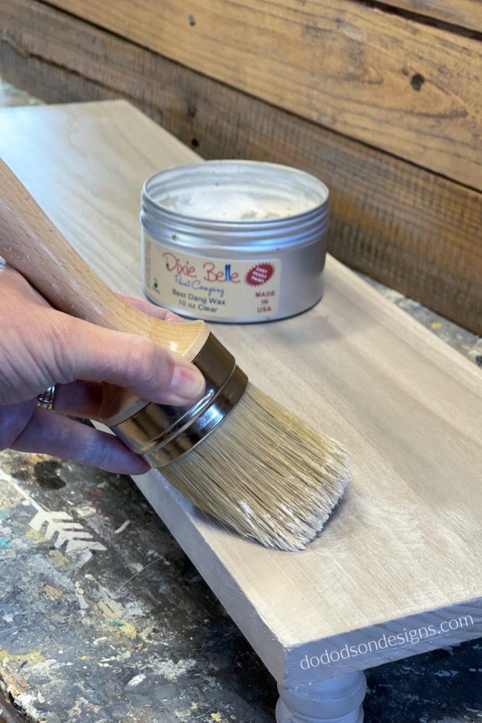 Apply clear wax over the table riser with a quality wax brush and buff with a soft cotton cloth. This will also fill on any open grain in the wood for a super smooth finish.