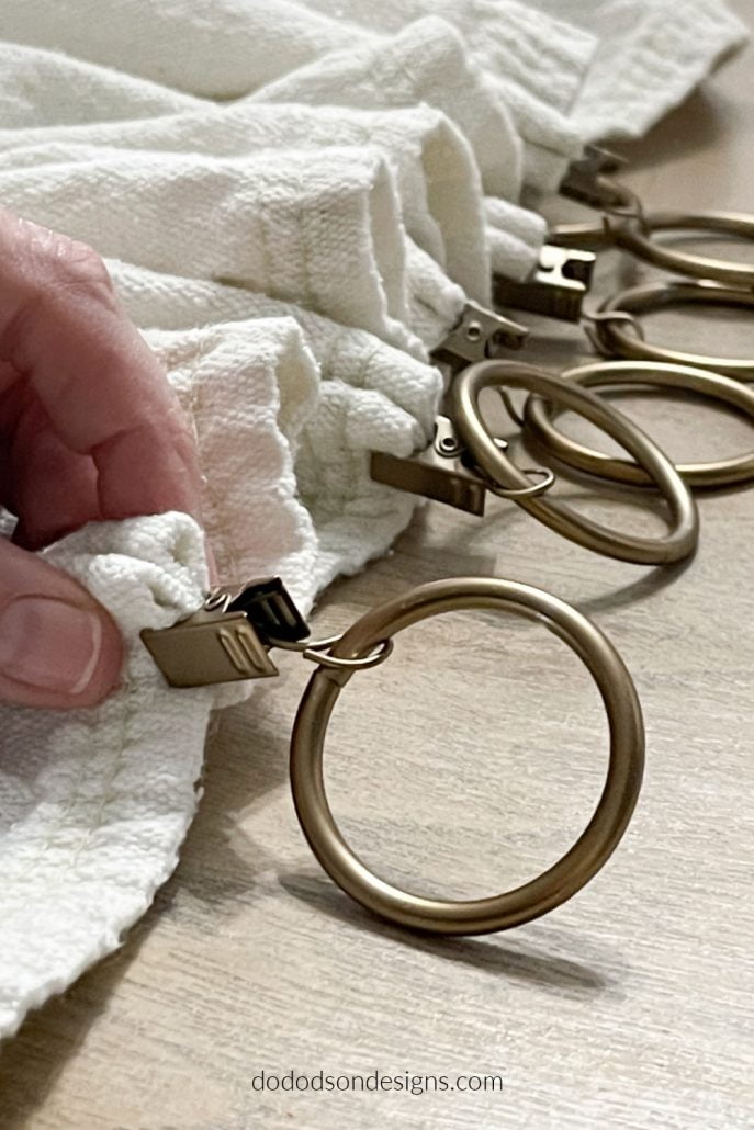 Can I say that these clips are everything when it comes to hanging your drop cloth curtains—no sewing or mess. Just clip and go. That's my kind of DIY.