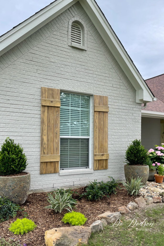 The grass is starting to green up, but my shrubs had seen better days after the hard sub-zero Winter we had here in Texas. We lost a lot of plants. So we did a major overhaul with new landscaping. I think it's a nice compliment to my new DIY wood shutters. Learn how to make them for your windows on the blog.