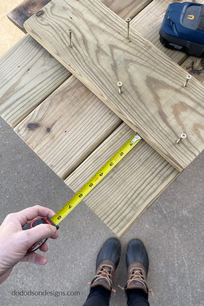 Line your cross pieces up equally on both ends of the DIY wood shutters and secure them together with wood screws.