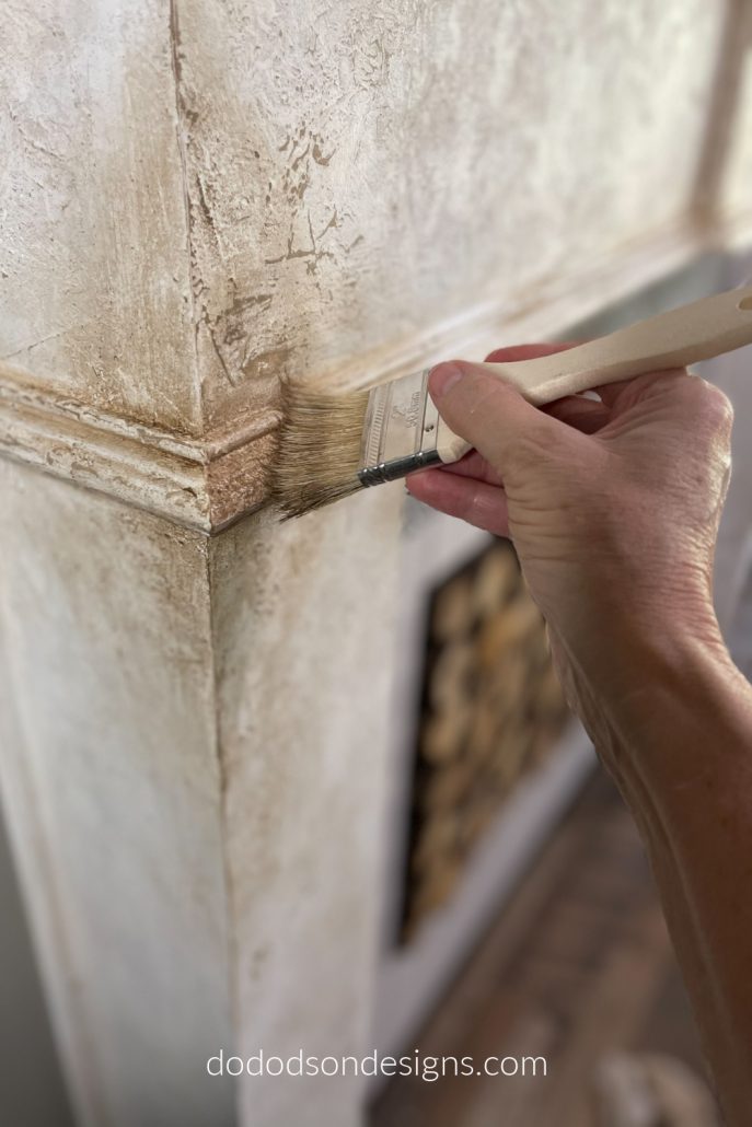 Adding a glaze over the DIY chipped paint technique was a great way to add some age to my fireplace makeover.