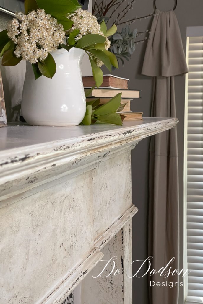 I couldn't love my my fireplace mantel more after adding this DIY chipped paint look. Learn this technique and get the full tutorial on my blog.