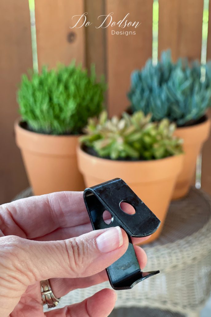 This is how I hang clay pots on my patio wall.