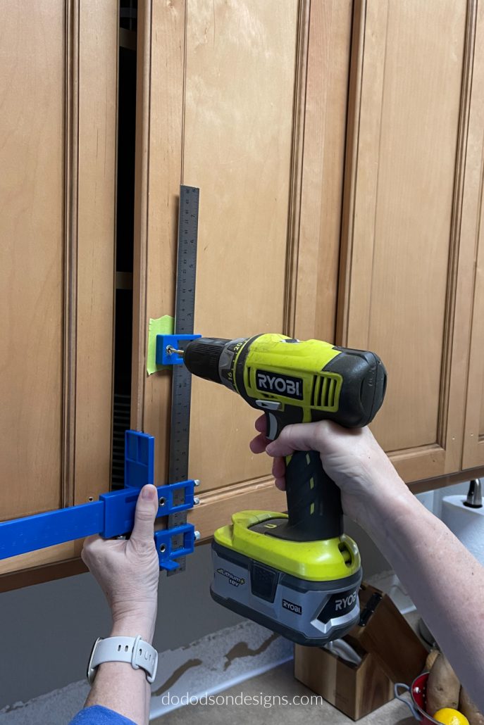 Before drilling those holes in your beautiful wood kitchen cabinets for new hardware, make sure to get perfect hole alignment with this cool tool.