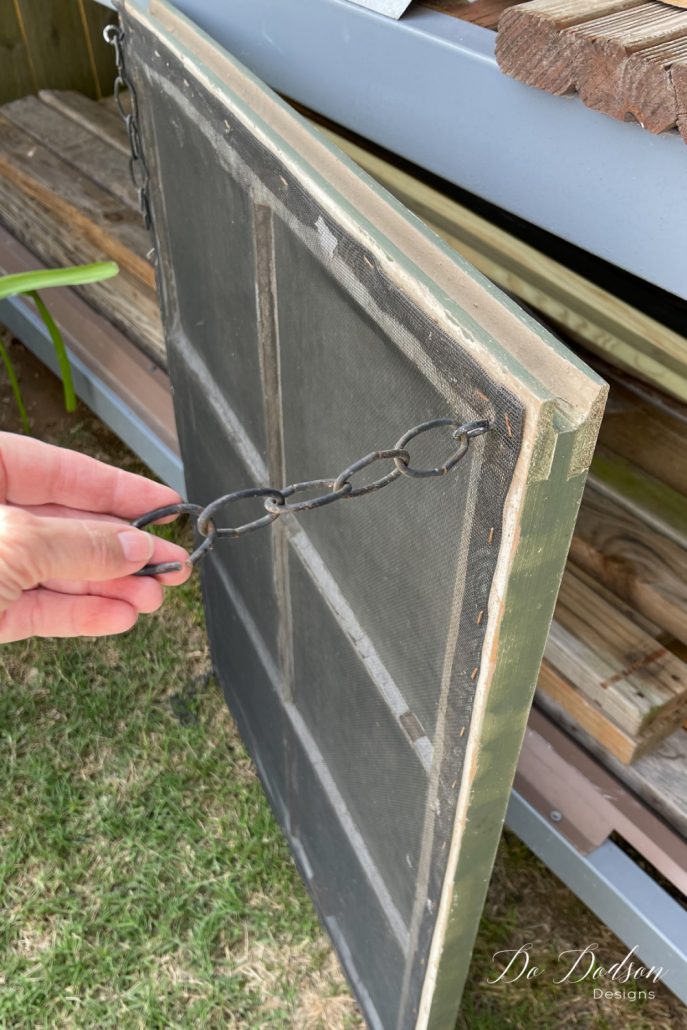 I added eye hooks and these decorative chains to the old window so that I could hang it from the ceiling.