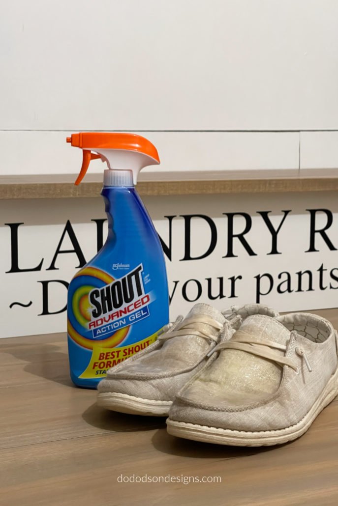 After using the rubbing alcohol to loosen the dried paint on my shoes and clothes, I sprayed the whole area with a stain remover before washing in the hottest water setting allowed. It worked!