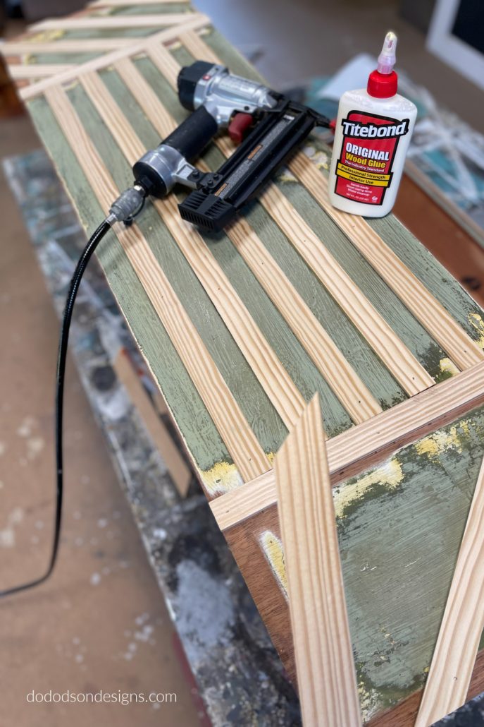 I created a modern design on the front of this cedar chest with wood trim. Best DIY decision to update this old cedar chest.