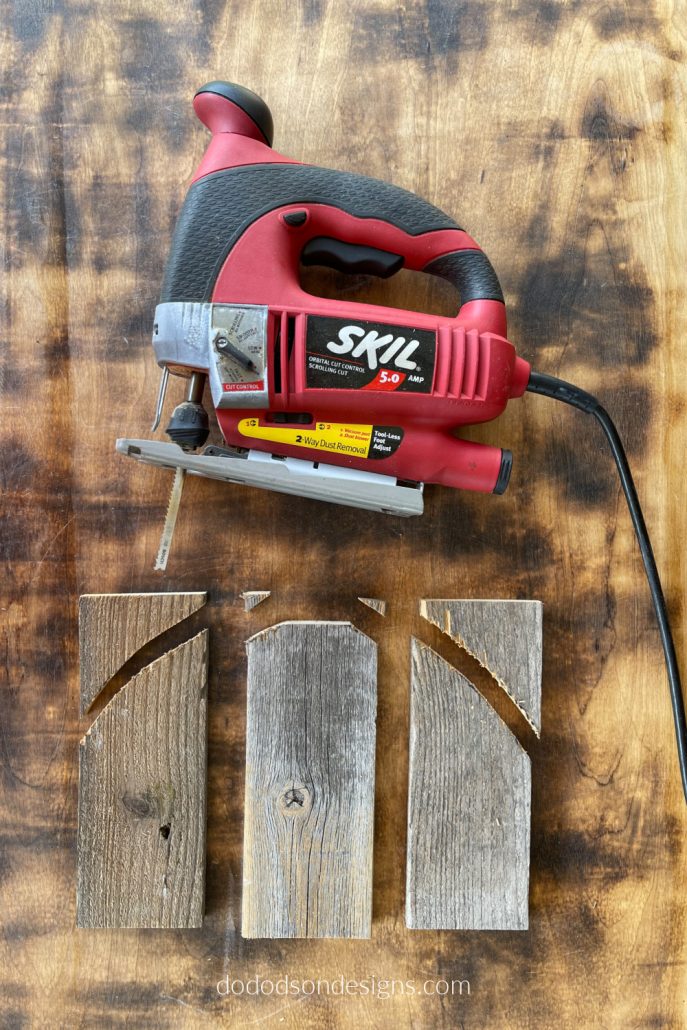 Use a jig saw to cut away the extra wood from your rustic pumpkins. This will give them shape after attaching them together. They're going to be so cute!