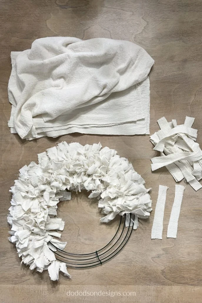 I made this gorgeous DIY drop cloth wreath in less than an hour with items I already had in my craft room. It feels so good to use up those scraps of fabric.