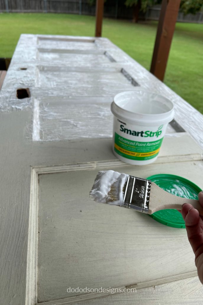 I used a new to me product to strip away several layers of paint on this wood pantry door.