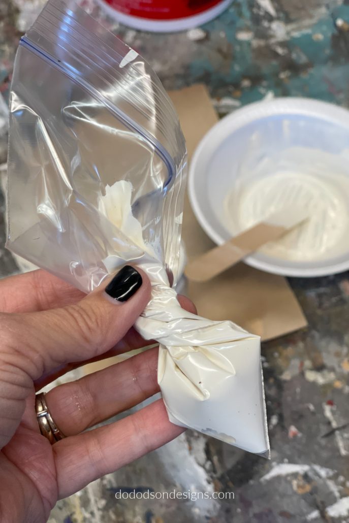 Mix one part plaster to one part paint to make a paste/icing that you can decorate your wood block Christmas trees with.