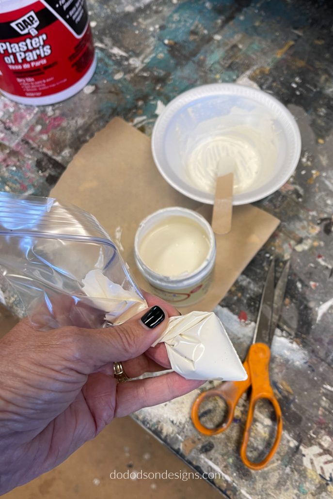 Mix one part plaster to one part paint to make a paste/icing that you can decorate your wood block Christmas trees with.