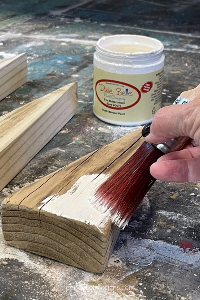 Before adding the decorations to your DIY wood block Christmas trees, add your favorite color of chalk mineral paint.