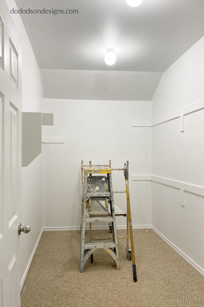A fresh coat of paint on the walls and trim was the beginning in DIY closet update in our master bedroom.