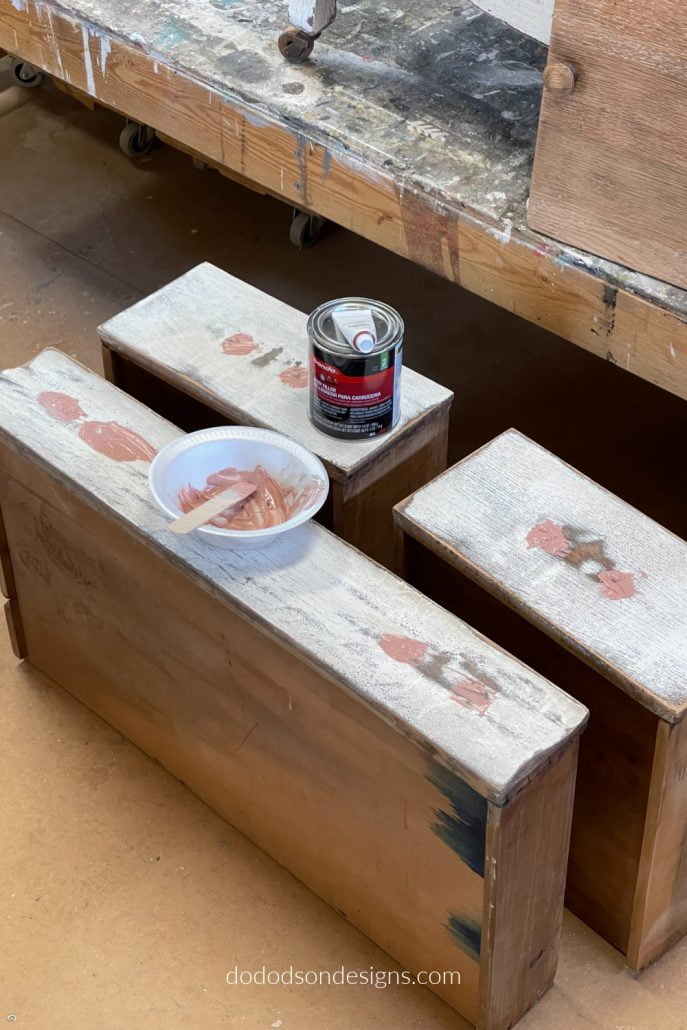 I like to use Bondo to repair wood damage and fill old hardware holes before painting and replacing with new ones.