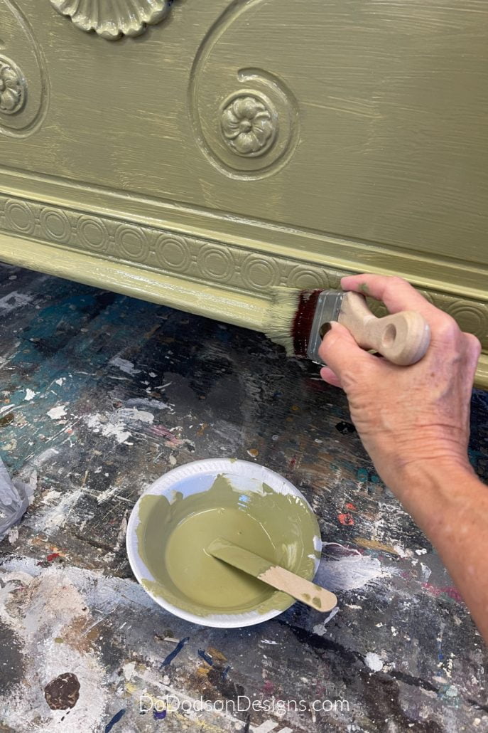 Like most chalk paints, it will take multiple coats depending on your color. Your first coat of paint will look like something like this. Remember, the first coat of paint on furniture is always the ugliest.