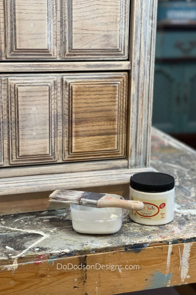 Whitewash made with chalk mineral paint for raw wood staining.