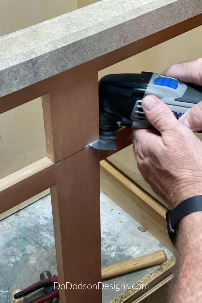We used a Dremel too to cut away the top part of the counter top and wood drawers before we installed the farmhouse sink.