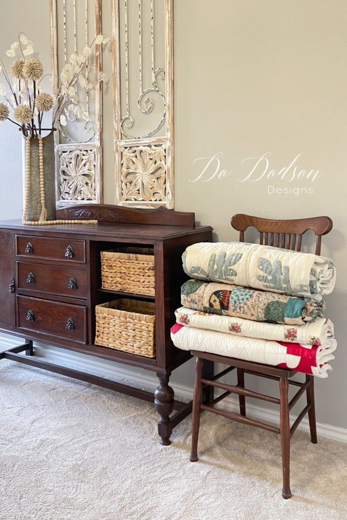 Why not stack a few of your favorite quilts in a chair in the corner of a bedroom? It's easy to access them if you get cold at night and need a little extra cover.