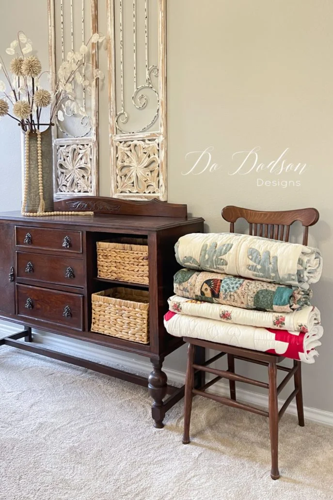 Why not stack a few of your favorite quilts in a chair in the corner of a bedroom? It's easy to access them if you get cold at night and need a little extra cover.