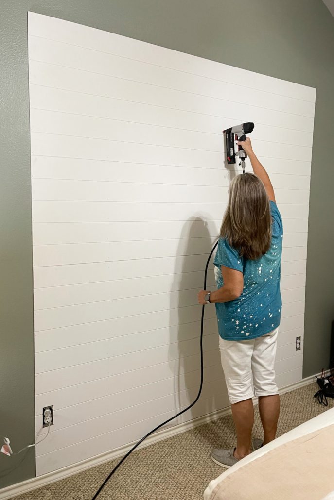 We secured the shiplap paneling accent wall with a finishing nails.