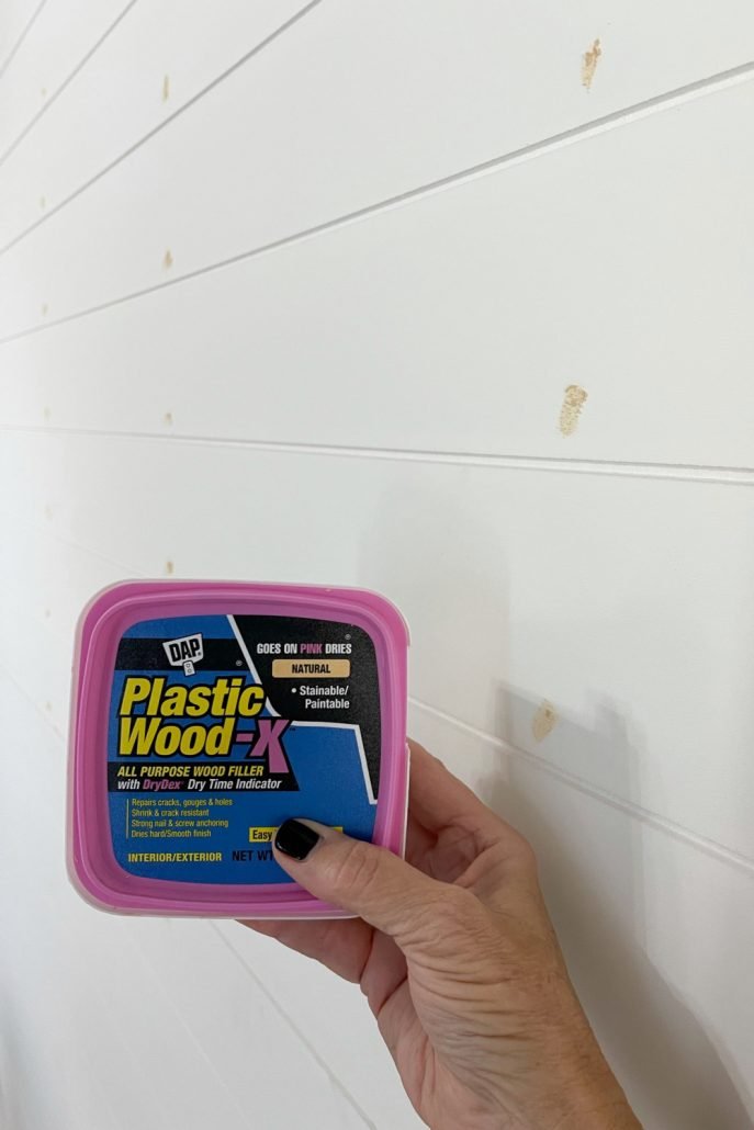 Use a good wood filler to cover the nail holes after installing the shiplap paneling.