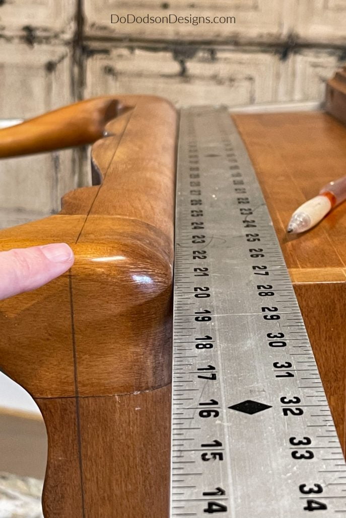Using a framing square (or any straight edge will do), established a straight line around the base of the coffee table just below where it is secured to the coffee tabletop. After cutting away the old legs, it's ready to attach the mew modern legs for a fantastic update. 