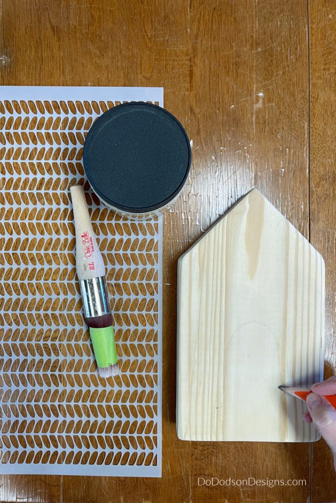 If you want to create a door or window, use a pencil to mark the area where you want your doors or windows to appear on the wood block.